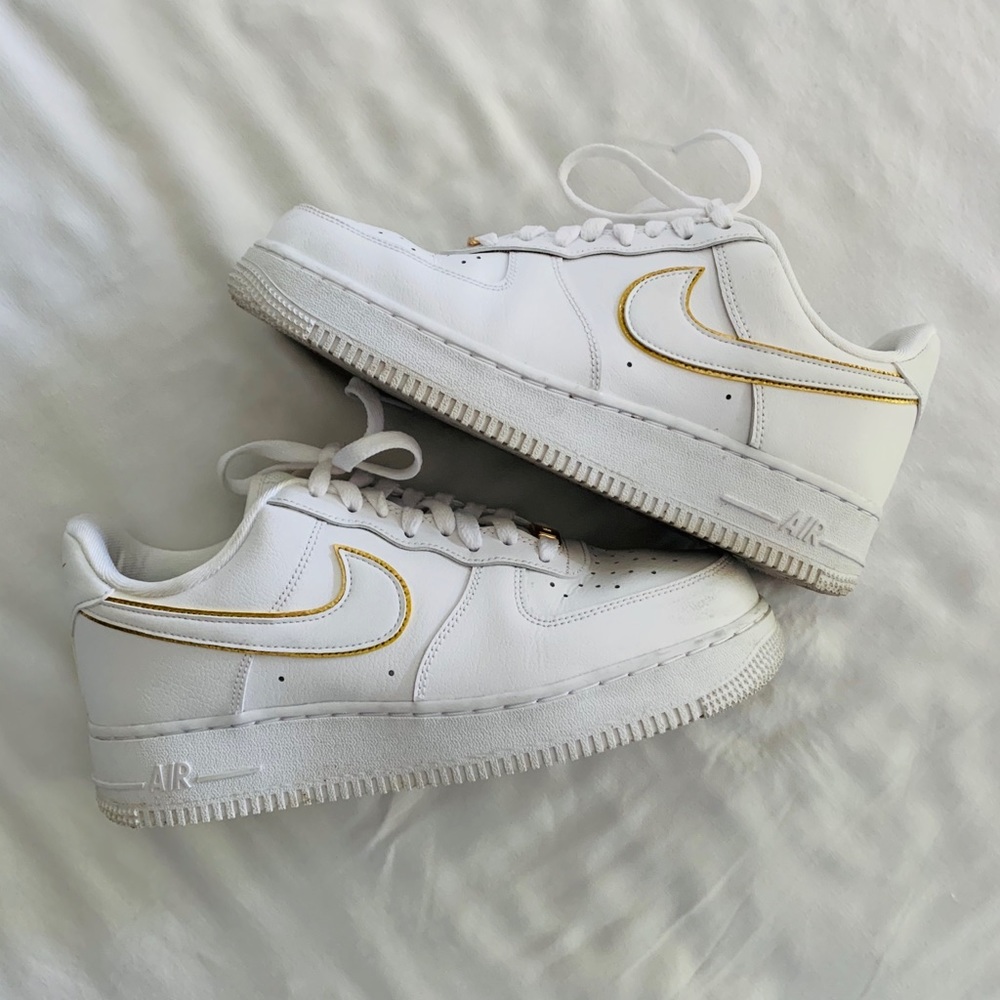 Nike Air Force 1’s with gold trim